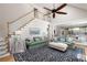 Bright open-plan living room with staircase leading to 2nd floor with eat-in kitchen in background at 3361 Woodington Se Ct, Marietta, GA 30067
