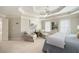 This primary bedroom with sitting area features a tray ceiling and lots of natural light at 3361 Woodington Se Ct, Marietta, GA 30067