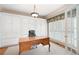 Home office with custom built-ins, wood desk, and natural light at 3361 Woodington Se Ct, Marietta, GA 30067