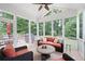 Relaxing screened-in porch with comfortable seating and a view of the backyard at 3361 Woodington Se Ct, Marietta, GA 30067