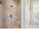 Shower offers beige tiling, a built-in bench, and updated fixtures at 3361 Woodington Se Ct, Marietta, GA 30067