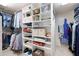 Well-organized walk-in closet with built-in shelving and hanging space for clothes and accessories at 3361 Woodington Se Ct, Marietta, GA 30067