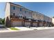 Modern townhomes with garage, stone accents, and balconies offering a stylish and functional living space at 3810 Jack Vernon Cir, Powder Springs, GA 30127