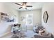 Home office with a glass desk, accent rug, and comfortable seating at 3810 Jack Vernon Cir, Powder Springs, GA 30127