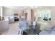 Bright, open kitchen flowing into the dining area featuring a glass table and chairs at 3810 Jack Vernon Cir, Powder Springs, GA 30127