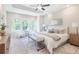 Bright main bedroom with large windows, a ceiling fan, and neutral decor at 3810 Jack Vernon Cir, Powder Springs, GA 30127