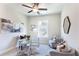 Stylish home office with a glass desk, plush chairs, and contemporary decor at 3810 Jack Vernon Cir, Powder Springs, GA 30127