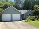 Charming single-story home featuring a two-car garage and lush landscaping in a serene neighborhood at 4302 Orange Court Nw Ct, Acworth, GA 30101