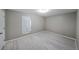 Bedroom with small window at 5807 Christopher Ln, Lithonia, GA 30058