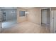 Neutral dining area open to living room and kitchen with modern light fixtures at 5807 Christopher Ln, Lithonia, GA 30058
