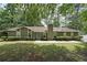 Ranch home featuring traditional styling, well-maintained landscaping and a symmetrical design at 5807 Christopher Ln, Lithonia, GA 30058