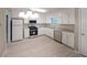 Bright kitchen features stainless steel appliances, granite countertops and ample cabinetry at 5807 Christopher Ln, Lithonia, GA 30058