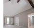 Spacious living room featuring hardwood style flooring, ample light and neutral paint at 5807 Christopher Ln, Lithonia, GA 30058