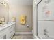 Bathroom with double sink vanity, shower with glass door, and modern fixtures at 9701 Buice Rd, Alpharetta, GA 30022