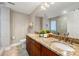 Bathroom with double sink vanity, granite countertop, and tiled shower at 9701 Buice Rd, Alpharetta, GA 30022