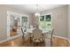 Cozy dining area with a round table, comfortable seating, and view of the backyard at 9701 Buice Rd, Alpharetta, GA 30022