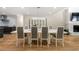 Stylish dining area featuring a modern table with seating for eight and brick fireplace at 9701 Buice Rd, Alpharetta, GA 30022
