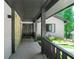 Inviting front porch with stone accent wall, stylish door, and concrete flooring at 9701 Buice Rd, Alpharetta, GA 30022