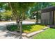 Well-manicured front yard with stone accents and ample parking space at 9701 Buice Rd, Alpharetta, GA 30022