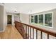 Bright hallway with hardwood floors, large windows, and natural light at 9701 Buice Rd, Alpharetta, GA 30022