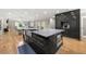 Well-appointed kitchen with a large island, stainless steel appliances, and modern finishes at 9701 Buice Rd, Alpharetta, GA 30022