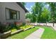 Beautifully landscaped yard with a curving stone walkway and well-maintained lawn at 9701 Buice Rd, Alpharetta, GA 30022
