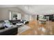 Spacious living room featuring modern decor, hardwood floors, and ample natural light at 9701 Buice Rd, Alpharetta, GA 30022