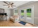 Relaxing sun room with comfortable seating, natural light, and access to the backyard at 9701 Buice Rd, Alpharetta, GA 30022
