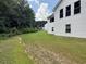 Backyard with lawn next to home at 2504 Dalesford Ct, Dacula, GA 30019