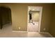 Finished basement area painted in warm neutral tones, access to storage at 2504 Dalesford Ct, Dacula, GA 30019