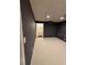 Finished basement featuring plush carpeting and a convenient adjacent half-bathroom at 2504 Dalesford Ct, Dacula, GA 30019