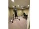 Basement with a boxing bag and chair at 2504 Dalesford Ct, Dacula, GA 30019