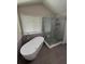 Bathroom featuring modern soaking tub, and glass enclosed shower at 2504 Dalesford Ct, Dacula, GA 30019