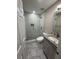 Newly renovated bathroom with marble floors, glass-enclosed shower, and modern fixtures at 2504 Dalesford Ct, Dacula, GA 30019