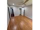 Bright bedroom featuring a ceiling fan and hardwood floors at 2504 Dalesford Ct, Dacula, GA 30019