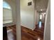 Hallway with hardwood floors and natural light flowing through at 2504 Dalesford Ct, Dacula, GA 30019