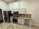 Modern kitchen with stainless steel appliances and ample cabinet space at 2504 Dalesford Ct, Dacula, GA 30019