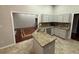 Well-lit kitchen with granite countertops, stainless sink, and modern cabinets at 2504 Dalesford Ct, Dacula, GA 30019