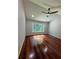 Spacious main bedroom with hardwood floors, a large window, and a ceiling fan at 2504 Dalesford Ct, Dacula, GA 30019