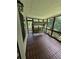 Cozy screened-in porch with a swing for relaxing outdoors at 2504 Dalesford Ct, Dacula, GA 30019