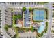 Aerial view of community amenities, including a pool, tennis court, splash pad, clubhouse, and playground at 2677 Sardis Chase Ct, Buford, GA 30519