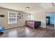 Bright bedroom with hardwood floors, large windows, and a daybed at 2677 Sardis Chase Ct, Buford, GA 30519
