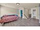 Bonus room with hardwood floors, neutral tones, and view of the stairs and bedroom at 2677 Sardis Chase Ct, Buford, GA 30519