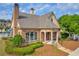 Clubhouse exterior with stone accents, manicured landscaping, and a pool nearby at 2677 Sardis Chase Ct, Buford, GA 30519
