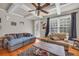 Bright living room with hardwood floors, a comfortable seating arrangement, and large windows for natural light at 2677 Sardis Chase Ct, Buford, GA 30519