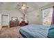 Cozy bedroom with vaulted ceiling, large windows, and carpeted floors at 2677 Sardis Chase Ct, Buford, GA 30519