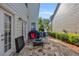 Outdoor patio features stone pavers, grill, and seating area perfect for entertaining guests at 2677 Sardis Chase Ct, Buford, GA 30519