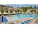 Community pool with clear water, lounge chairs, and seating areas at 2677 Sardis Chase Ct, Buford, GA 30519
