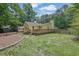 Spacious backyard with large deck, shed, and plenty of grassy area at 502 Allen Dr, Lawrenceville, GA 30043