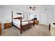 Bright bedroom featuring a four-poster bed, neutral walls, and two windows that provide natural light at 502 Allen Dr, Lawrenceville, GA 30043